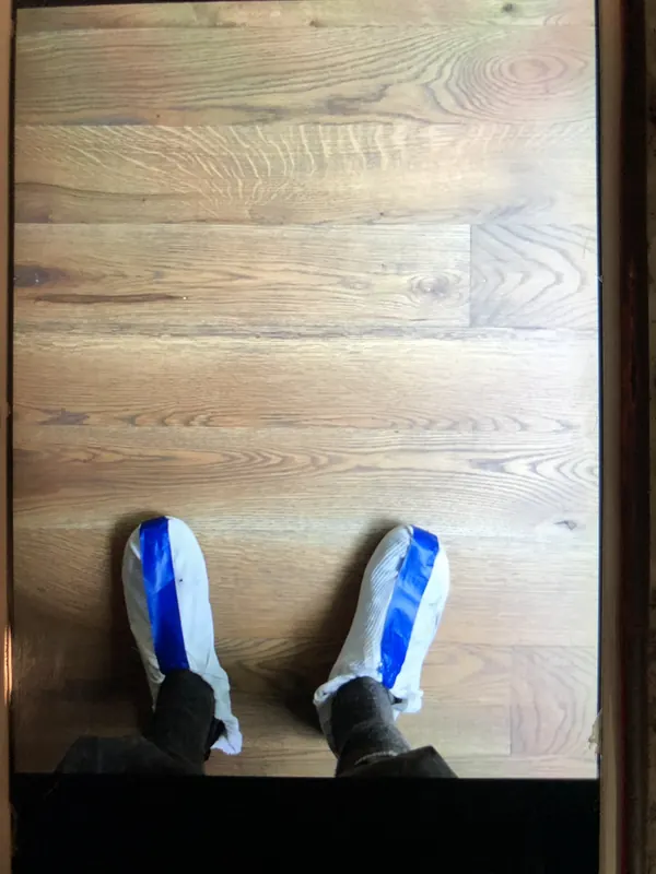 Shoe covers on newly finished wide boards