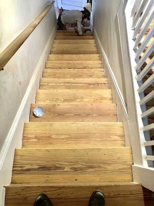 Staircase with pine treads viewed from the bottom step