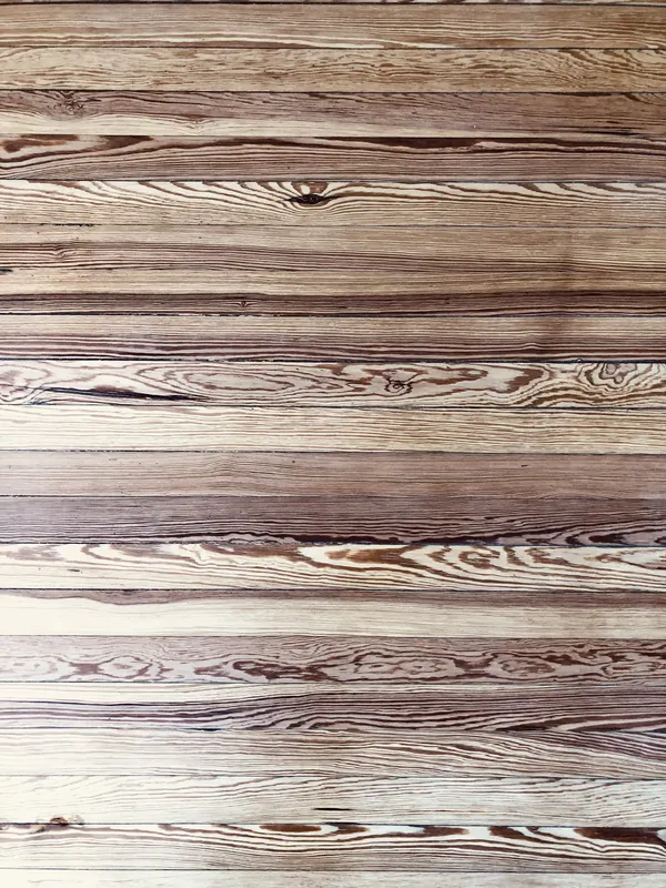 Very wide heart pine boards filling the frame with rippled grain