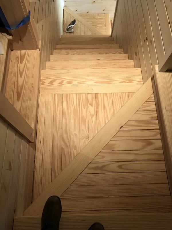 Unfinished pine staircase under construction