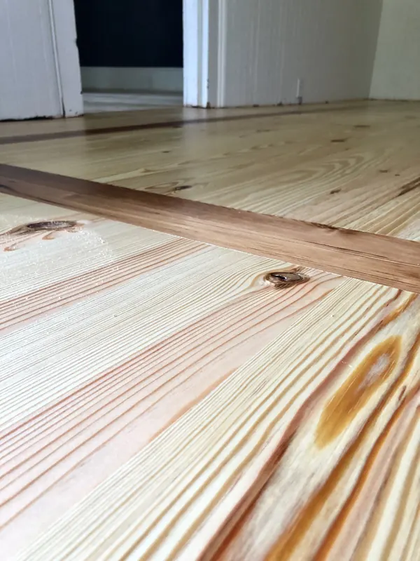 Close view of pine boards with dark amber resin lines