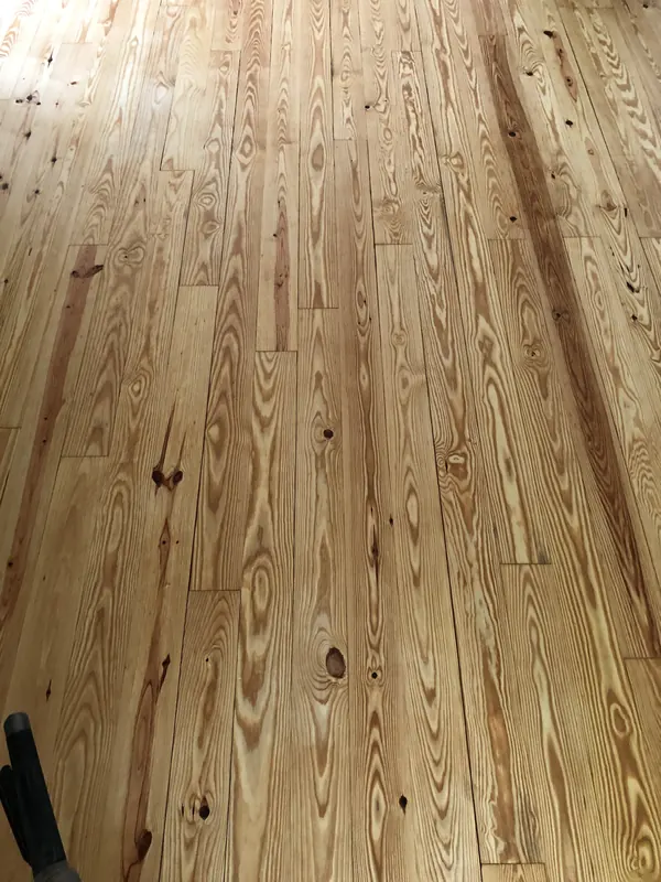 Clean heart pine floor with even honey tone