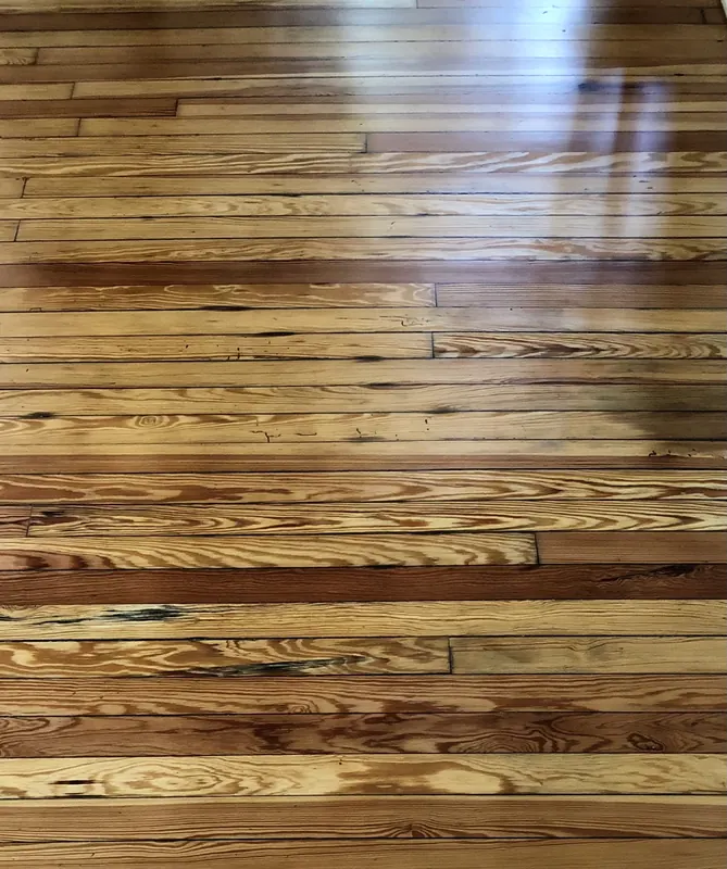 Multi-toned glossy heart pine floor with strong figure
