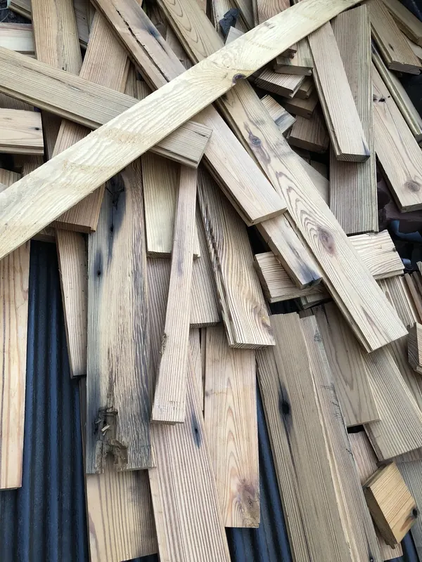 Pile of reclaimed timber offcuts stacked loose