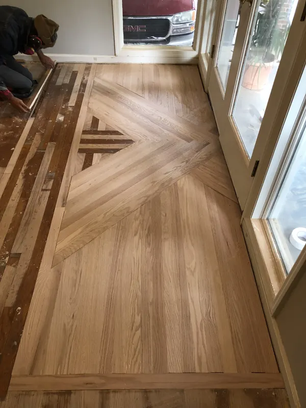 Pale floor with a contrasting inlaid cross detail