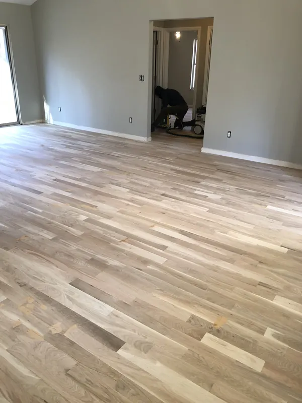 Very pale grey-white oak floor in an empty room