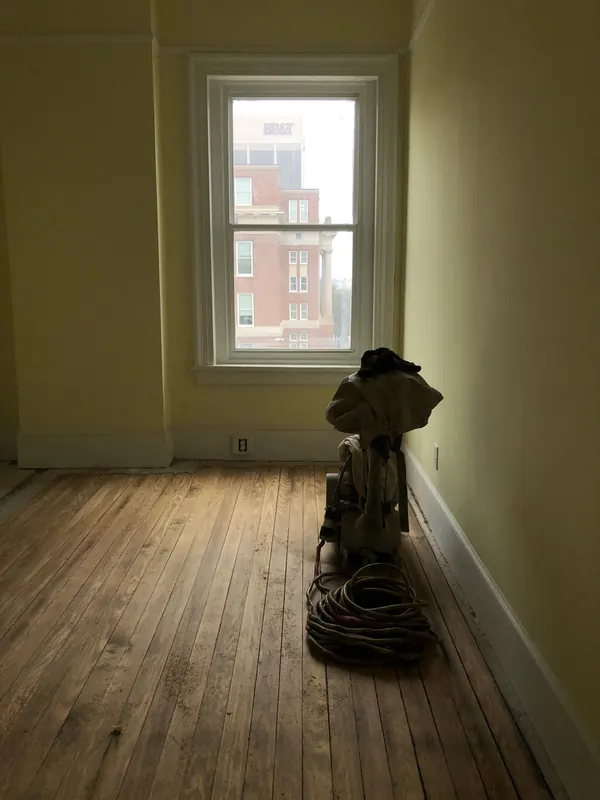 Cast iron stove standing on a refinished pine floor