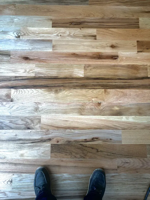Light reclaimed boards with boots at the edge of frame