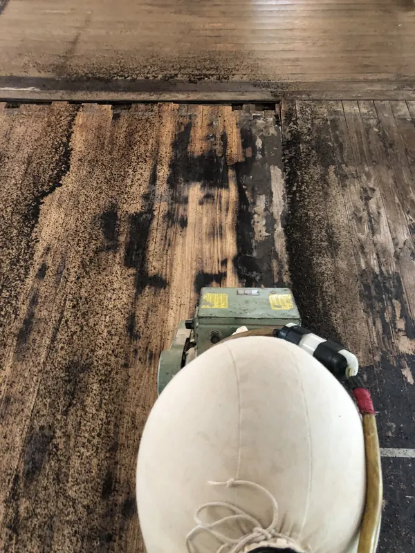 Sander on a very dark worn floor