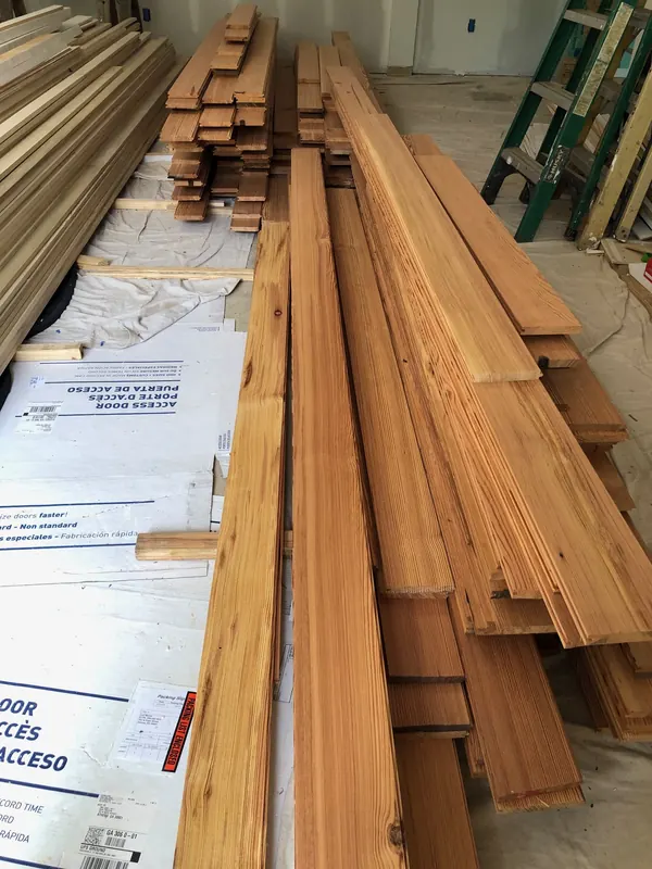 Bundles of new flooring stacked ready to lay