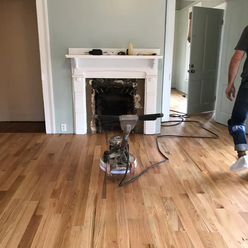 Sander in front of a white fireplace