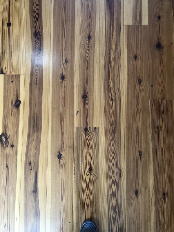 Warm pine boards with dark knots running through